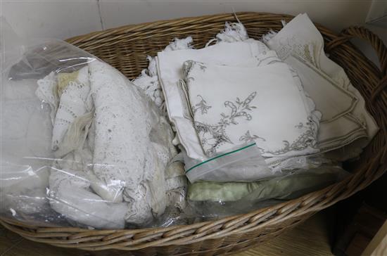 A collection of linen and tablecloths in basket